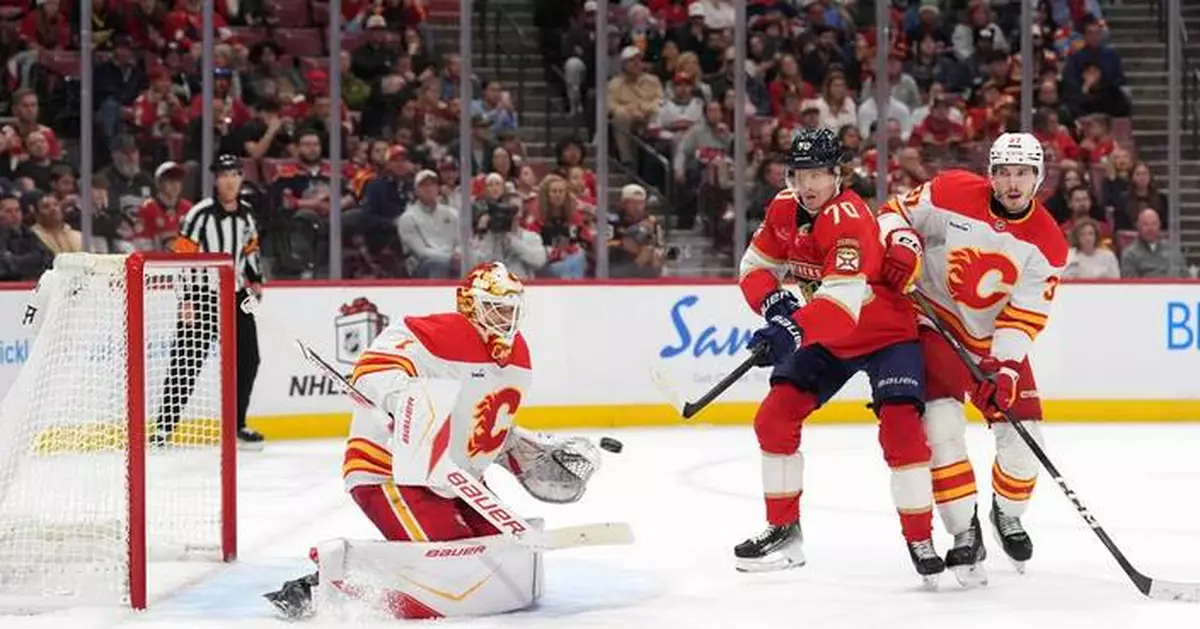 Kadri helps Flames beat Panthers 5-3, sending Cup champs to 4th loss in 6 home games