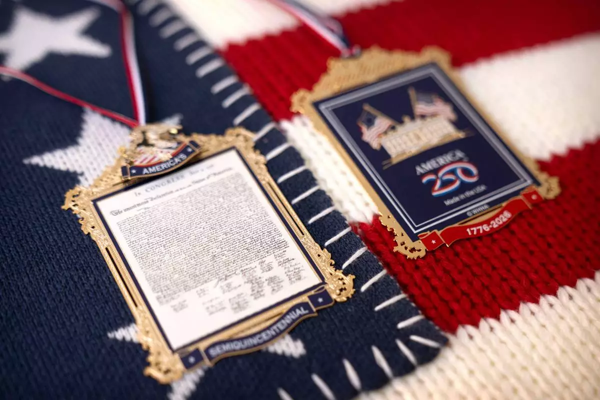 The front and back of a commemorative ornament released by America250 as part of events leading up to the 250th anniversary of the signing of the Declaration of Independence in 1776, is photographed Thursday, Nov. 13, 2025, in Washington. (AP Photo/Mark Schiefelbein)
