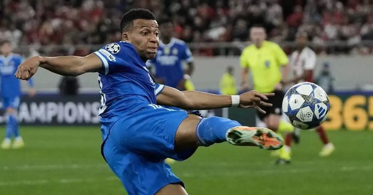 Mbappé nets quick hat trick in his 4-goal game as Real Madrid beats Olympiakos in Champions League