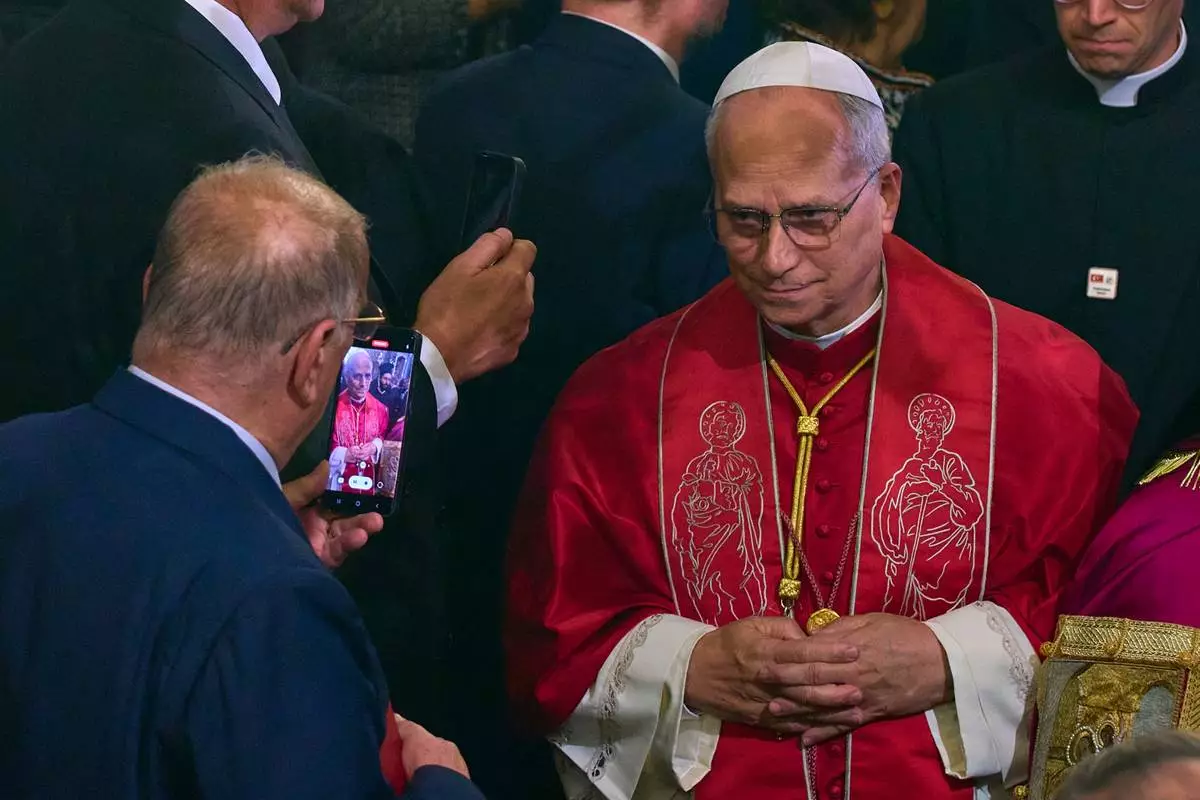 Pope Leo XIV leaves at the end of the Doxology in the Patriarchal Church of Saint George in Istanbul, Turkey, Saturday, Nov. 29, 2025. (AP Photo/Domenico Stinellis)