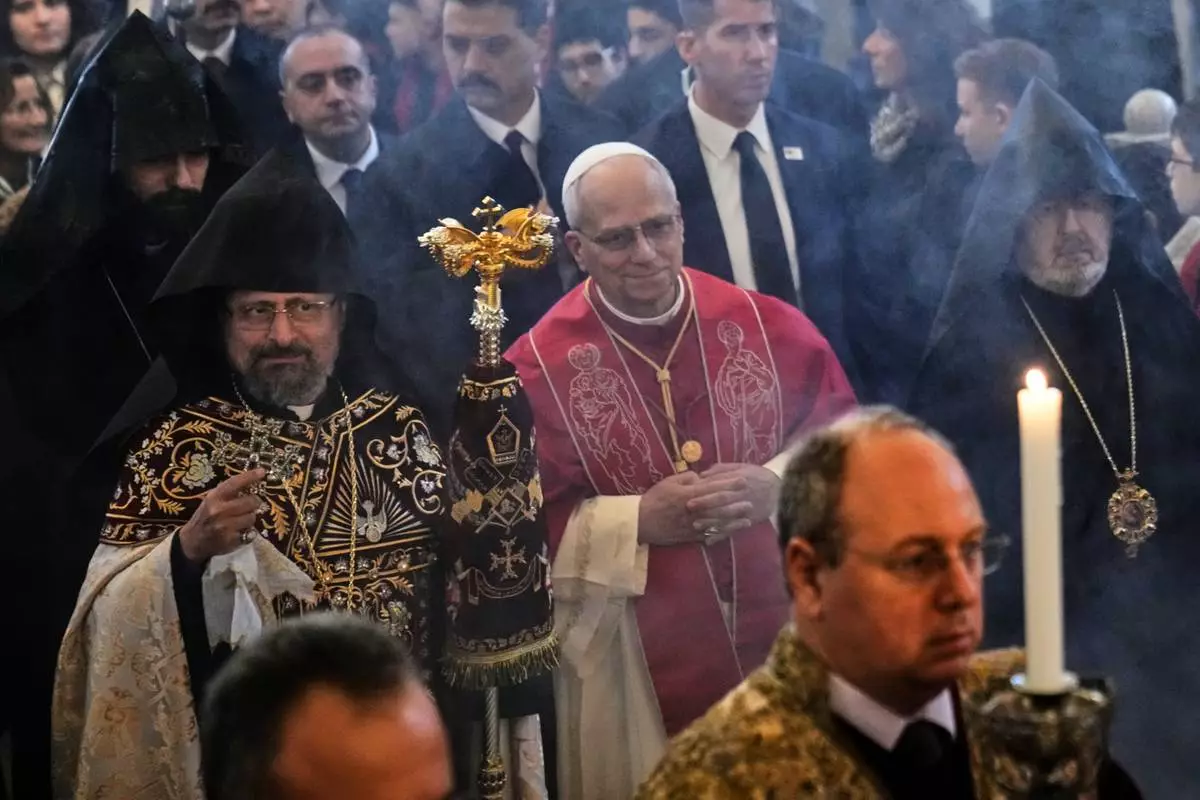 Pope Leo XIV and the Armenian Patriarch of Constantinople Archbishop Sahag II Mashalian arrive to celebrate a liturgy in the Armenian Apostolic Cathedral of Istanbul, Turkey, Sunday, Nov. 30, 2025. (AP Photo/Domenico Stinellis)
