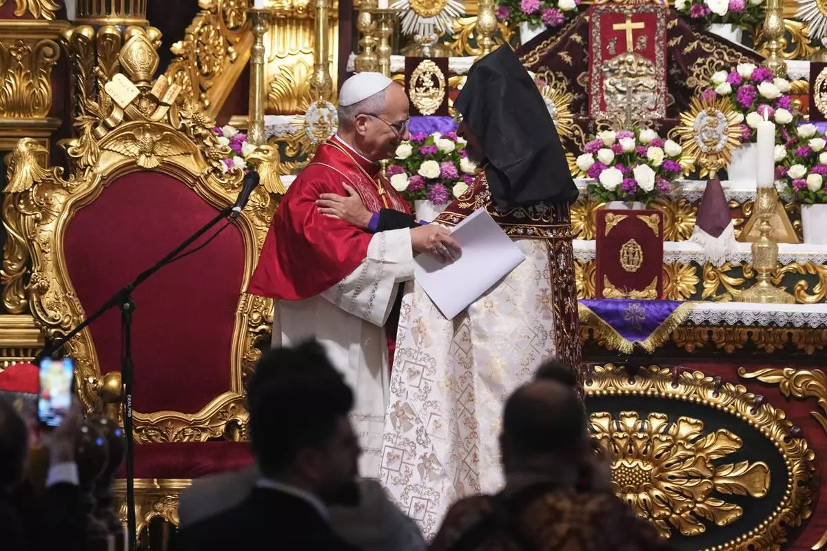 Pope Leo XIV and the Armenian Patriarch of Constantinople Archbishop Sahag II Mashalian celebrate a liturgy in the Armenian Apostolic Cathedral of Istanbul, Turkey, Sunday, Nov. 30, 2025. (AP Photo/Domenico Stinellis)
