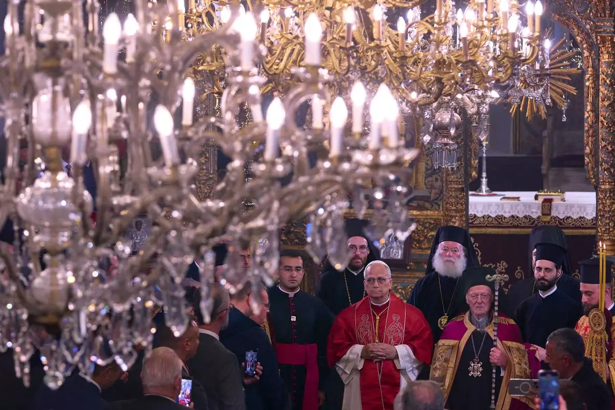 Pope Leo XIV and Ecumenical Patriarch Bartholomew I, right, participate into the Doxology in the Patriarchal Church of Saint George in Istanbul, Turkey, Saturday, Nov. 29, 2025. (AP Photo/Domenico Stinellis)