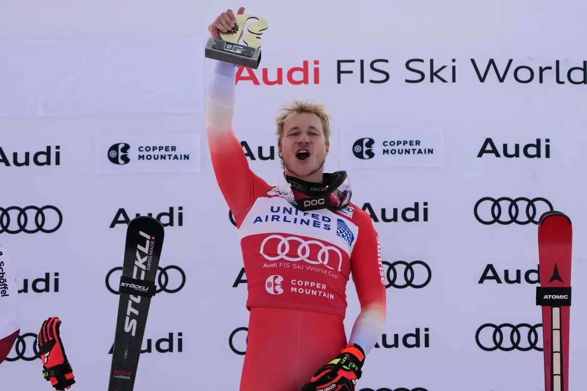Switzerland's Marco Odermatt celebrates after winning a World Cup men's super-G skiing race, Thursday, Nov. 27, 2025, in Copper Mountain. (AP Photo/John Locher)