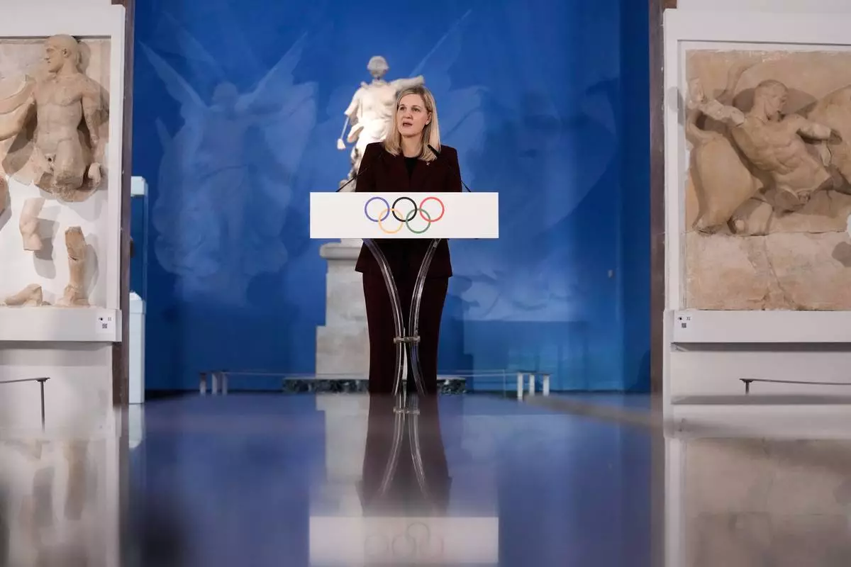 Kirsty Coventry, President of the International Olympic Committee, delivers a speech during the flame lighting ceremony for the Milan Cortina 2026 Winter Olympics, at the archaeological museum of Olympia, Greece, Wednesday, Nov. 26, 2025. (AP Photo/Thanassis Stavrakis)