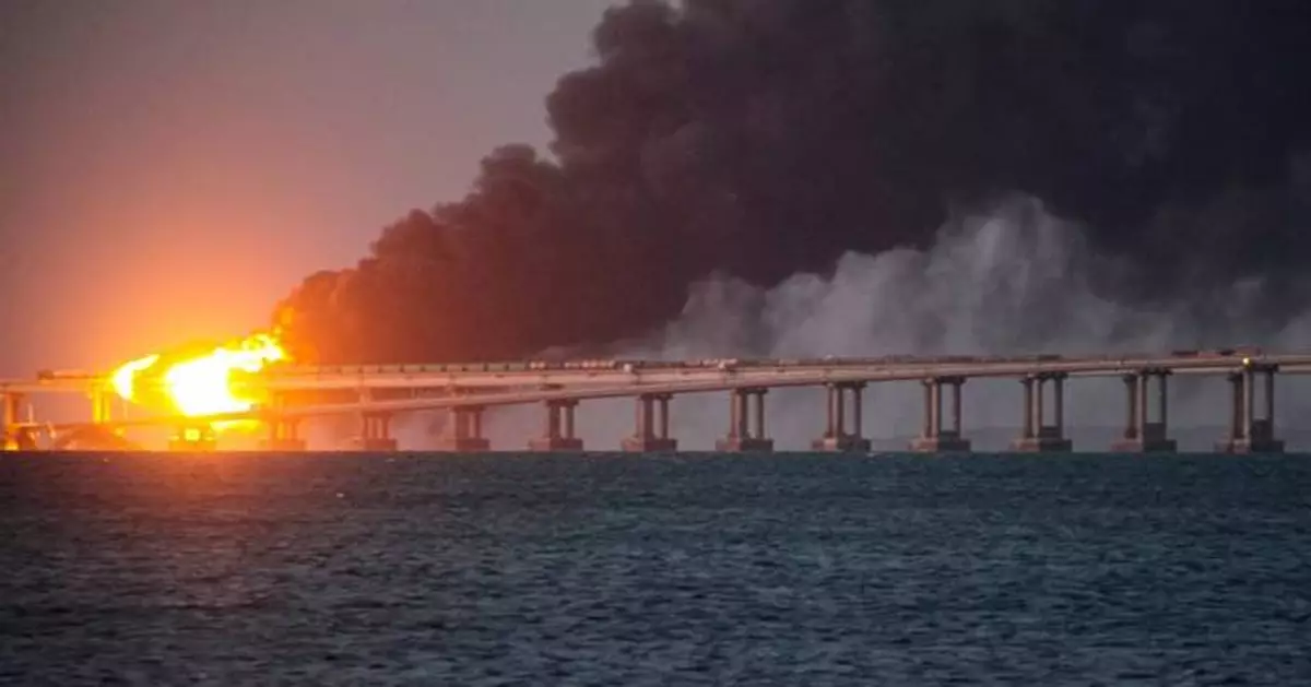 Russia convicts and hands life sentences to 8 people over attack on a key bridge to Crimea