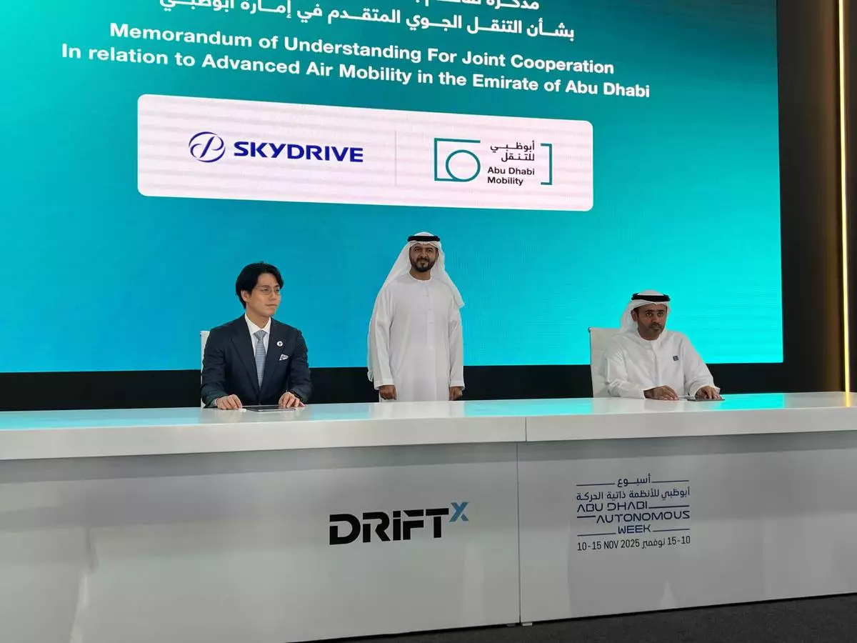 Right: Dr.Abdulla Hamad AlGhfeli, Acting Director General of the Integrated Transport Centre (ITC) / Center; His Excellency, Dr. Saif Al Nasri, Undersecretary of the Department of Municipalities and Transport/Left: Takehiko Sato, Chief Strategy Officer, SkyDrive. The signing ceremony was held at "DRIFTx," an automotive and mobility event held in Abu Dhabi on November 11, 2025.