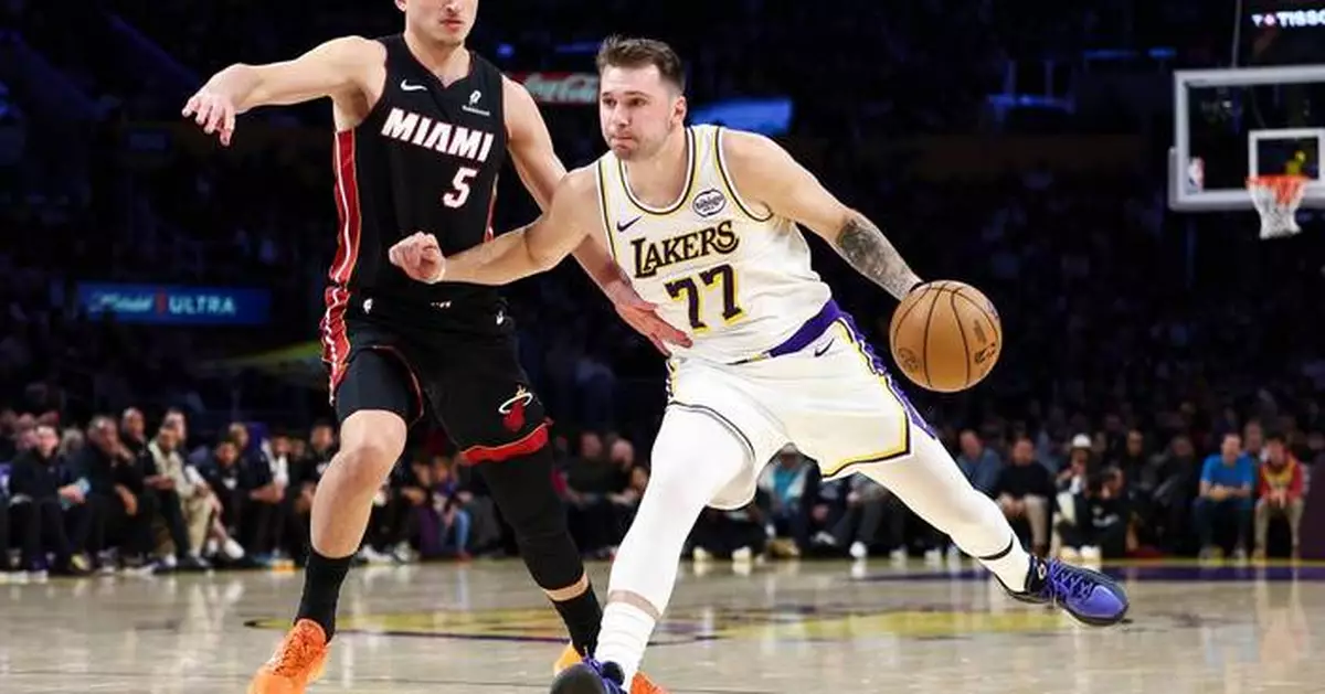 Lakers beat Heat 130-120 behind Doncic's triple-double