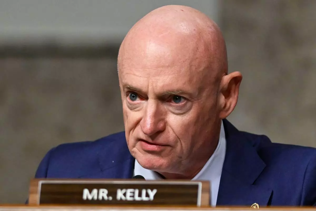 FILE - Sen. Mark Kelly, D-Ariz., speaks during a Senate Intelligence Committee hearing, at the Capitol in Washington, Jan. 15, 2025. (AP Photo/John McDonnell, File)