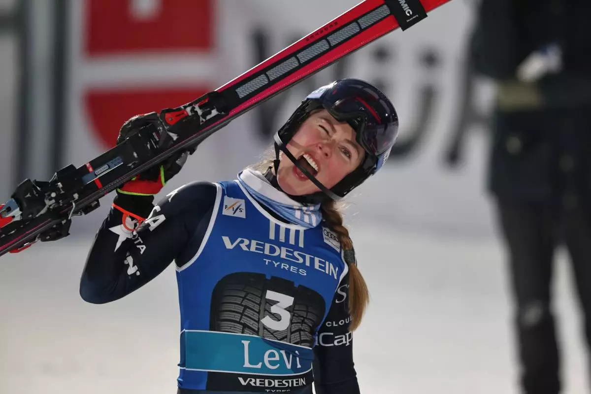 United States' Mikaela Shiffrin celebrates after winning an alpine ski, women's World Cup slalom, in Levi, Finland, Saturday, Nov. 15, 2025. (AP Photo/Marco Trovati)