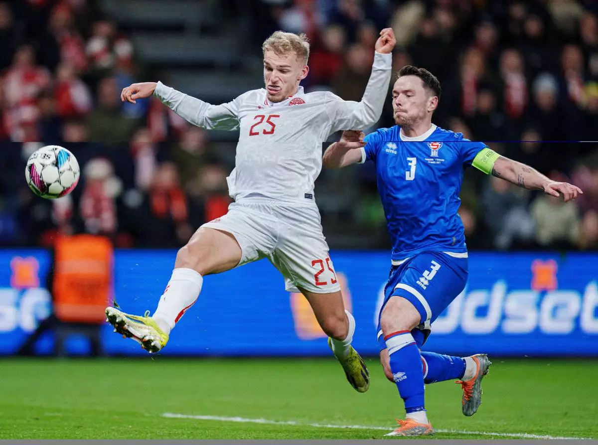 FILE - Denmark's Gustav Isaksen and the Faroe Islands' Viljormur Davidsen battle for the ball during an international friendly soccer at Broendby Stadium, Tuesday, March 26, 2024, in Copenhagen, Denmark. (Liselotte Sabroe/Ritzau Scanpix via AP, File)