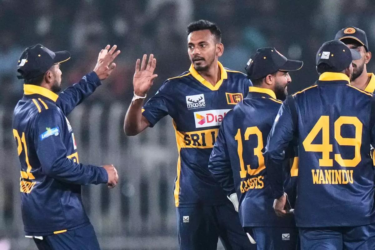 Sri Lanka's Dushmantha Chameera, center, celebrates with teammates after the dismissal of Pakistan's Saim Ayub during the second one day international cricket match between Pakistan and Sri Lanka, in Rawalpindi, Pakistan, Friday, Nov. 14, 2025. (AP Photo/Anjum Naveed)
