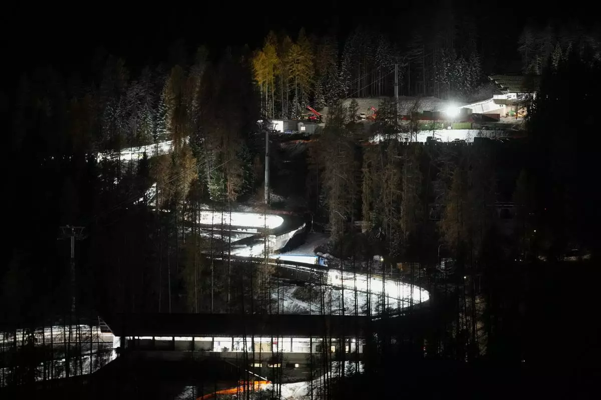 A night view of the Eugenio Monti sliding track during a three day skeleton and bobsled World Cup stage and Olympic test event in Cortina D'Ampezzo, Friday, Nov. 21, 2025. (AP Photo/Andrew Medichini)