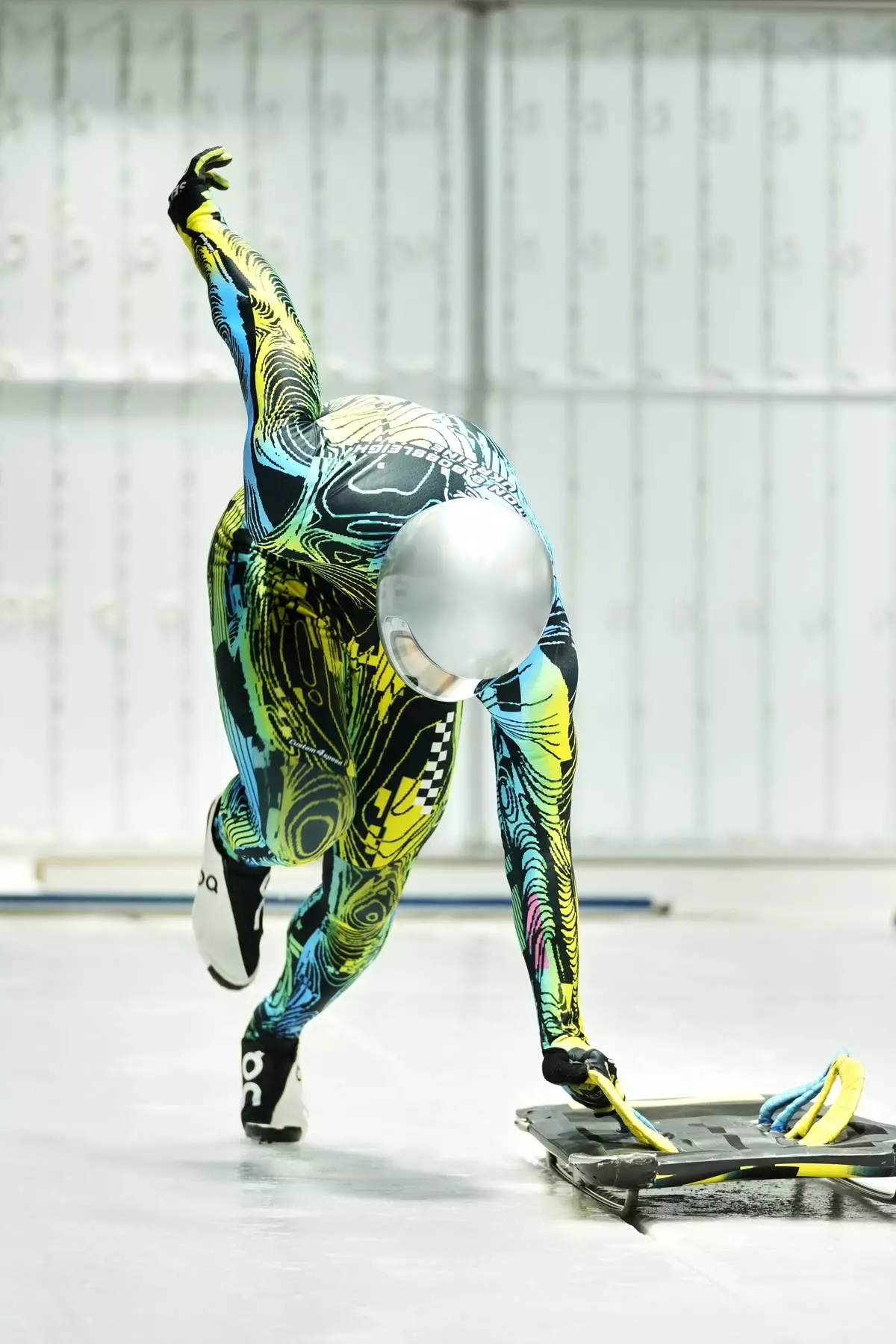 Ukraine's Yaroslav Lavreniuk takes the start at a training session ahead of a three-day skeleton and bobsled World Cup stage and Olympic test event in Cortina D'Ampezzo, Italy, Wednesday, Nov. 19, 2025. (AP Photo/Andrew Medichini)