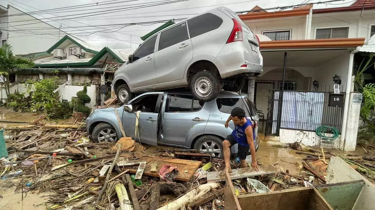 Vehicles lie piled on after flooding caused by Typhoon Kalmaegi in Cebu city, central Philippines, Tuesday, Nov. 4, 2025. (AP Photo/Jacqueline Hernandez)