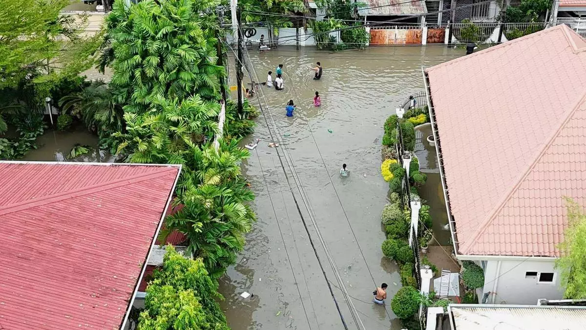 Residential areas are flooded by Typhoon Kalmaegi as it affects Cebu city, central Philippines, Tuesday, Nov. 4, 2025. (AP Photo/Jacqueline Hernandez)