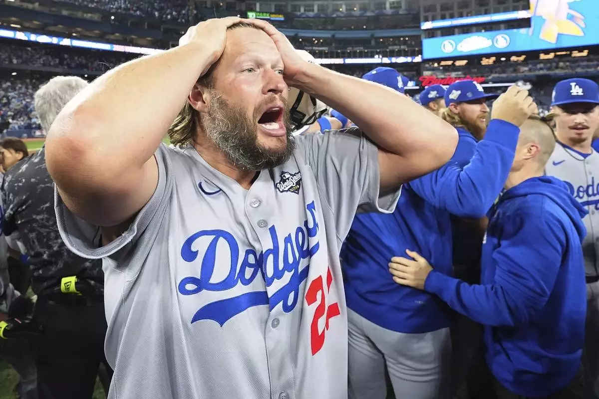 Los Angeles Dodgers pitcher Clayton Kershaw celebrates after the Dodgers defeated the Toronto Blue Jays in Game 7 of baseball's World Series, Sunday, Nov. 2, 2025, in Toronto. (Frank Gunn/The Canadian Press via AP)