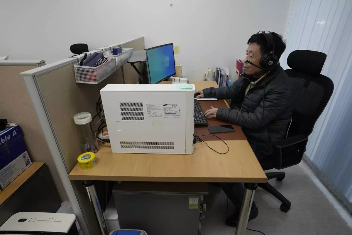 HOLD - Kim Ki-sung, a staff of the Free North Korea Radio station, works at his office in Seoul, South Korea, Monday, Nov. 17, 2025. (AP Photo/Ahn Young-joon)