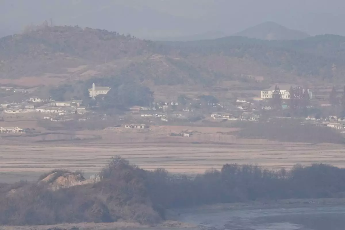North Korea's Kaepoong town is seen from the Unification Observation Post in Paju, South Korea, Saturday, Nov. 22, 2025. (AP Photo/Ahn Young-joon)