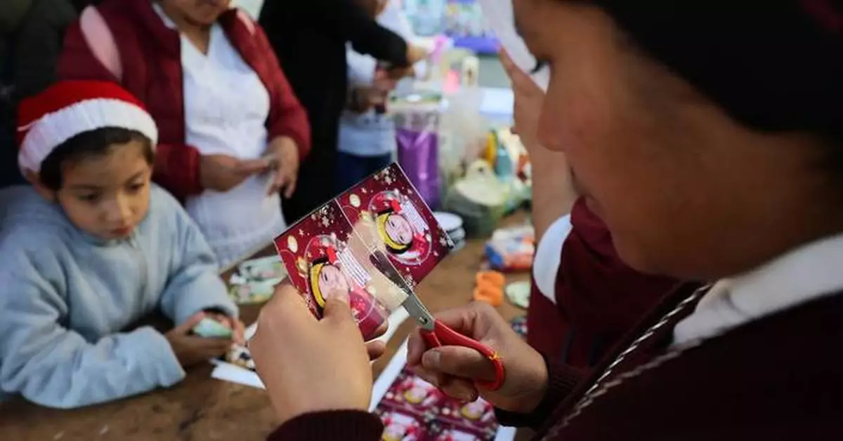 A Christmas tree in Mexico carries the faces of loved ones who never came home