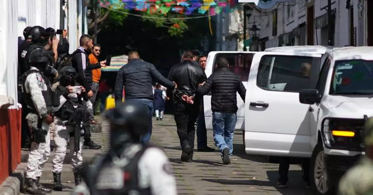 Authorities arrest 7 bodyguards in connection with a Mexican mayor's assassination