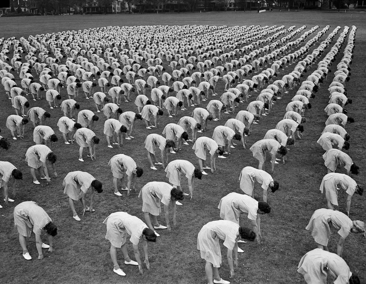 FILE - Over 2,000 members of the Women's Army Auxiliary Corps (WAAC) take part in a mass calisthenics exercise in Fort Oglethorpe, Ga., on May 15, 1943. (AP Photo/B.I. Sanders, File)