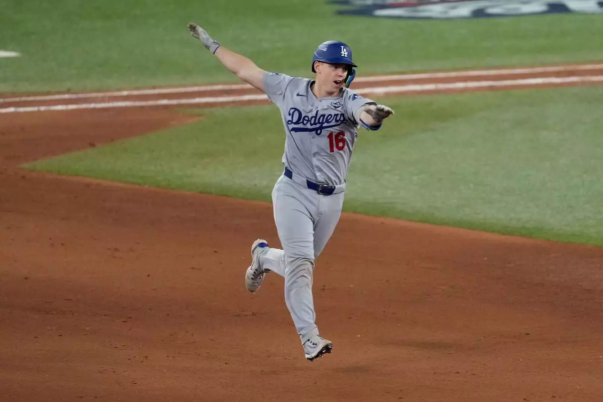 Los Angeles Dodgers' Will Smith celebrates his home run against the Toronto Blue Jays during the 11th inning in Game 7 of baseball's World Series, Sunday, Nov. 2, 2025, in Toronto. (AP Photo/Ashley Landis)