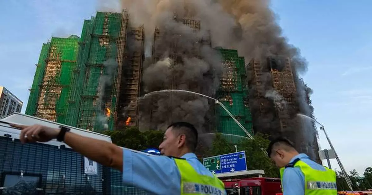 3 arrested in Hong Kong, as a high-rise fire leaves at least 44 dead and 279 reported missing