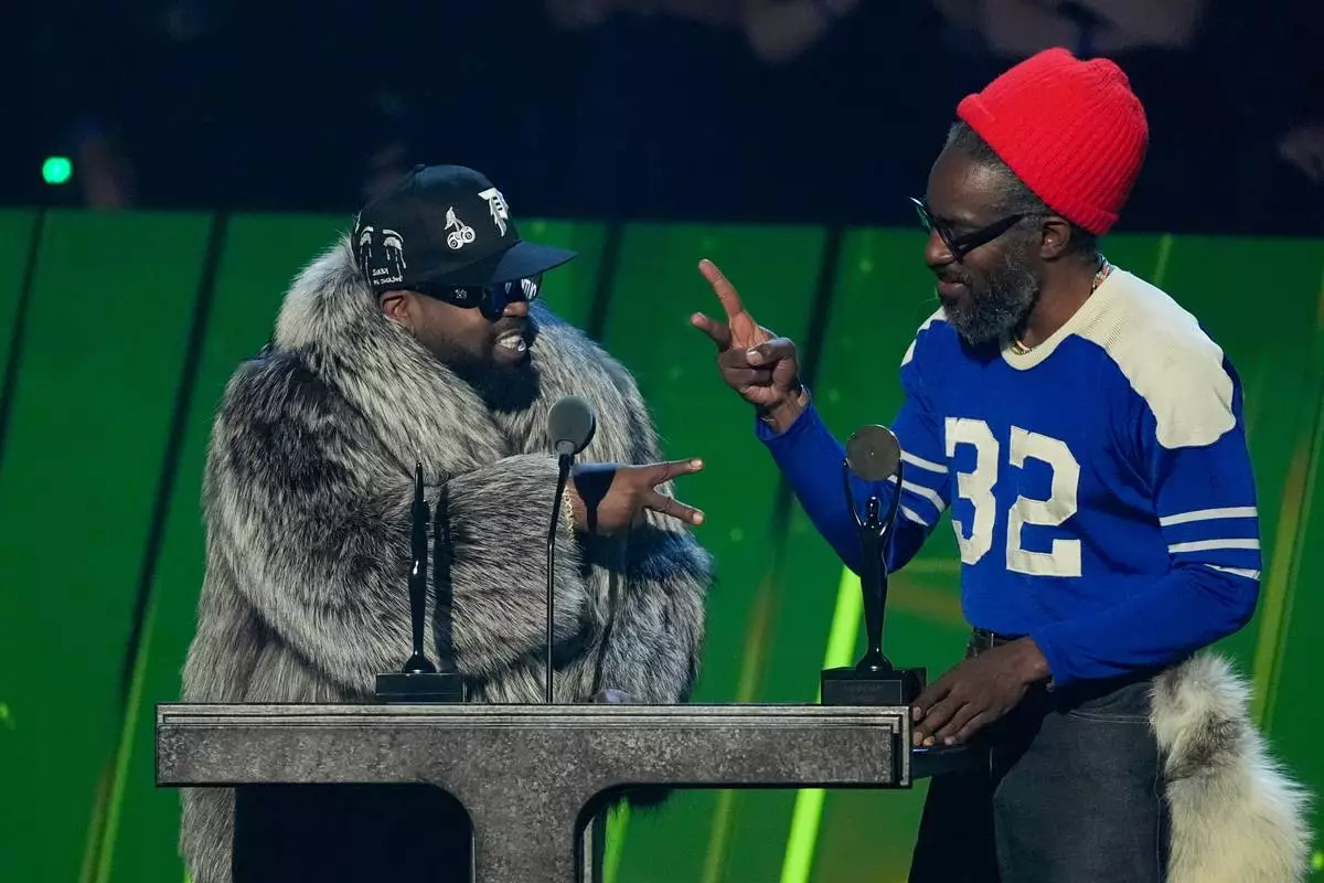 Inductees Big Boi, left and André 3000 of OutKast during the 2025 Rock and Roll Hall of Fame Induction Ceremony on Saturday, Nov. 8, 2025, at L.A. Live in Los Angeles. (AP Photo/Chris Pizzello)