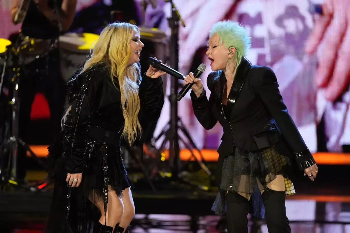 Avril Lavigne, left and Cyndi Lauper perform during the 2025 Rock and Roll Hall of Fame Induction Ceremony on Saturday, Nov. 8, 2025, at L.A. Live in Los Angeles. (AP Photo/Chris Pizzello)
