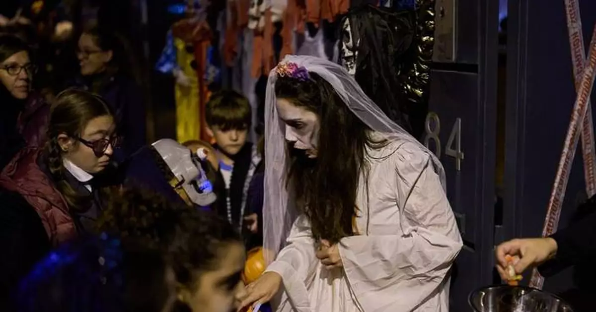 Halloween and a declining Christian tradition coexist on All Saints' Day in Spain