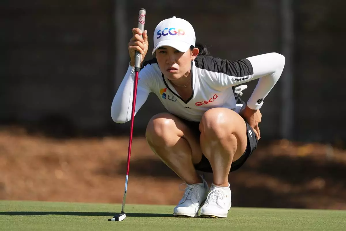 CORRECTS FIRST NAME - Pajaree Anannarukarn of Thailand looks at her shot on the second green during the third round of the LPGA Tour Championship golf tournament, Saturday, Nov. 22, 2025, in Naples, Fla. (AP Photo/Marta Lavandier)
