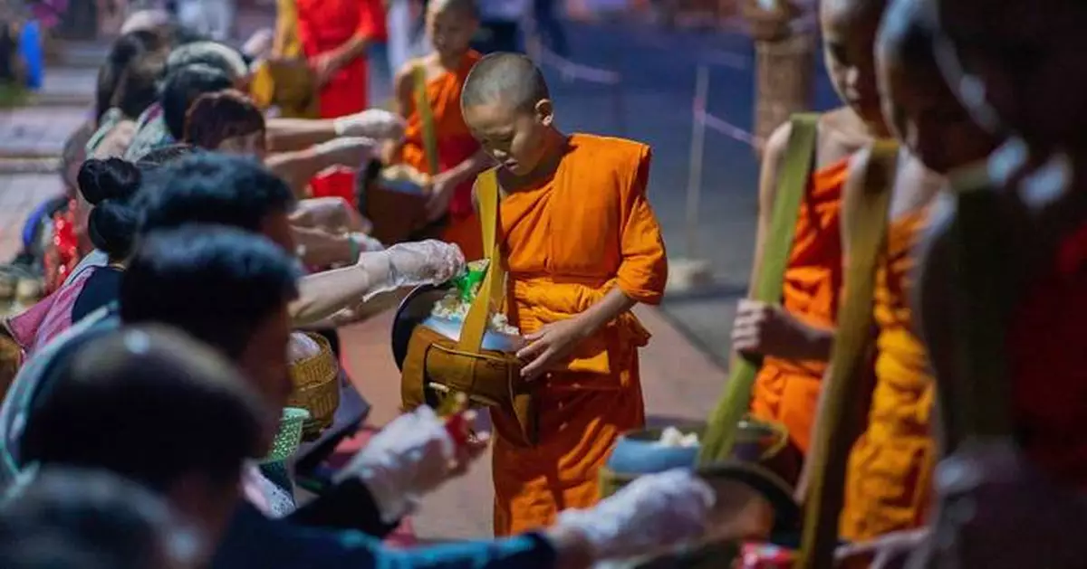 Photos of Buddhist monks in Laos praying in region littered with unexploded bombs