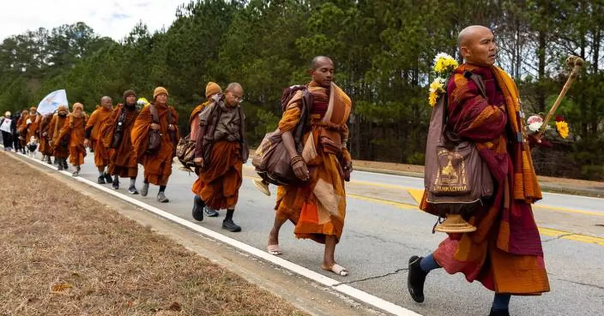 Buddhist monks persist in peace walk despite injuries as thousands follow them on social media