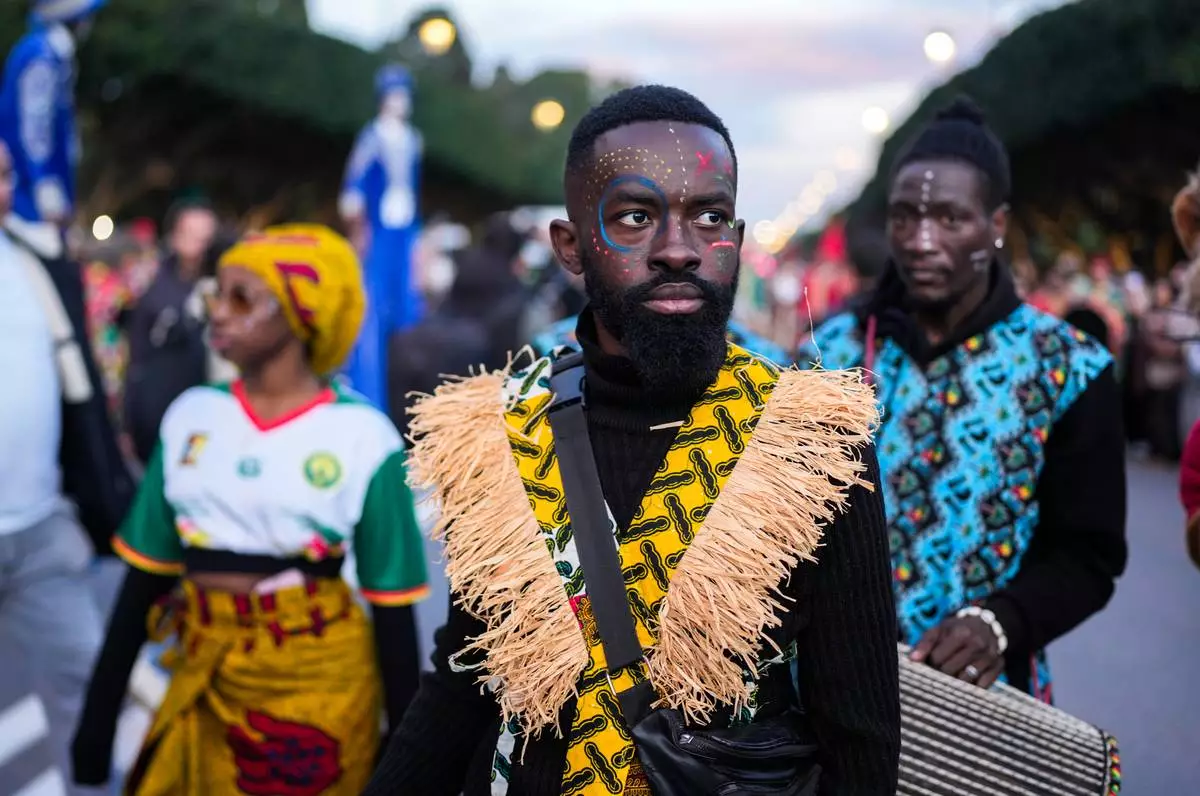 People take part in a parade celebrating the upcoming Africa Cup of Nations soccer competition, in Rabat, Morocco, Saturday, Dec. 20, 2025. (AP Photo/Mosa'ab Elshamy)