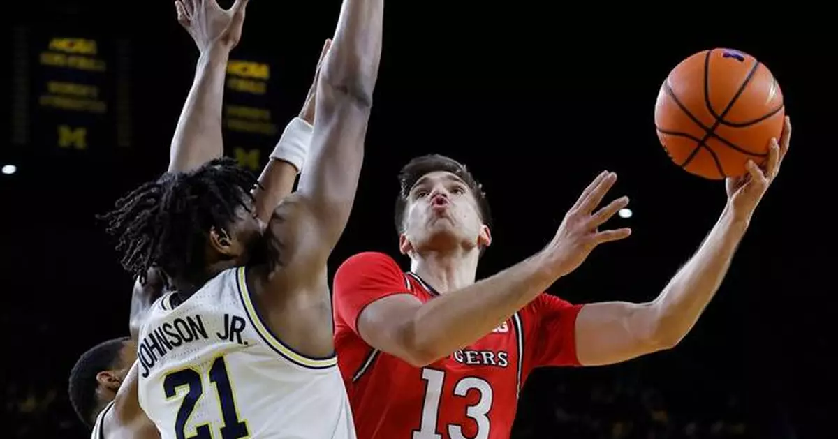 Johnson scores 22 as No. 3 Michigan routs Rutgers 101-60
