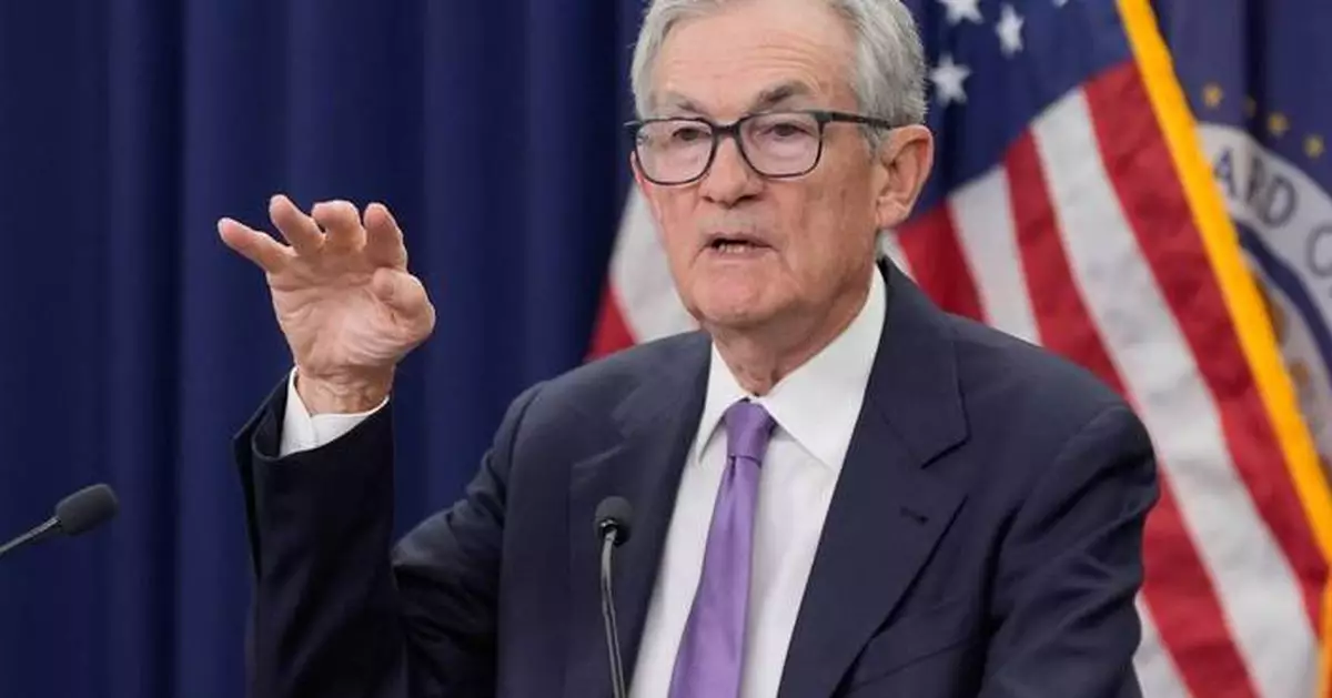 Federal Reserve cuts key rate, sees healthier economy next year