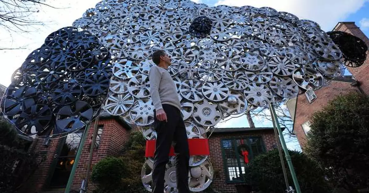 Baltimore cyclist finds joy in collecting lost hubcaps and stringing them into art