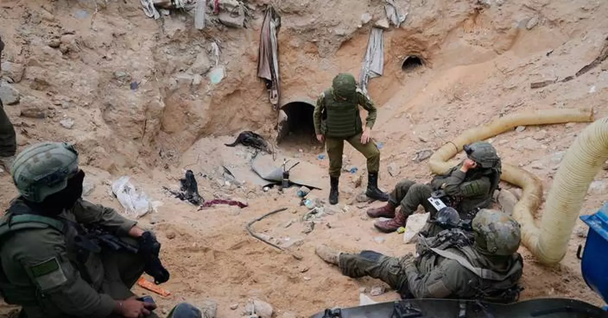 Israeli army takes journalists into a tunnel in a Gaza city it seized and largely flattened