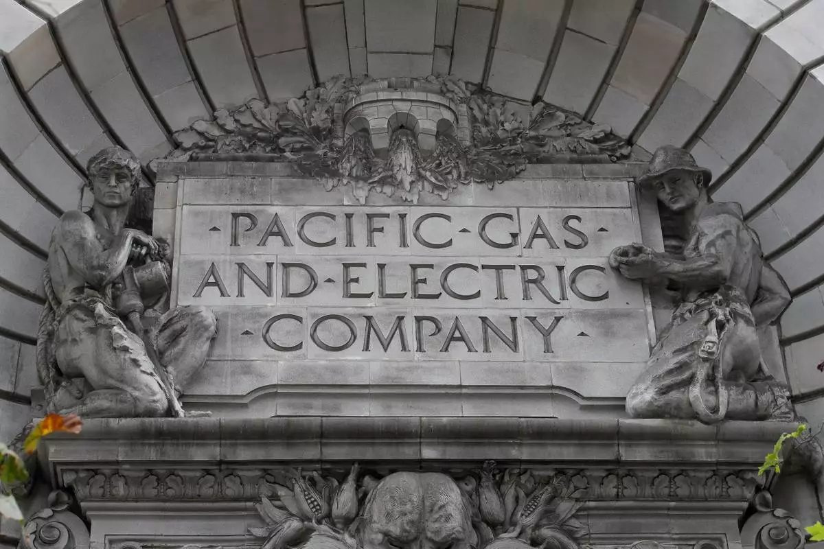 FILE - A Pacific Gas &amp; Electric sign is displayed on the exterior of a PG&amp;E building in San Francisco on April 16, 2020. (AP Photo/Jeff Chiu, File)