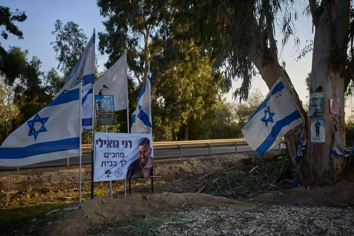 A memorial site at the spot where Ran Gvili, the last hostage in the Gaza Strip, was killed while fighting Hamas militants, stands in Kibbutz Alumim, Israel, Thursday, Dec. 4, 2025. (AP Photo/Ohad Zwigenberg)