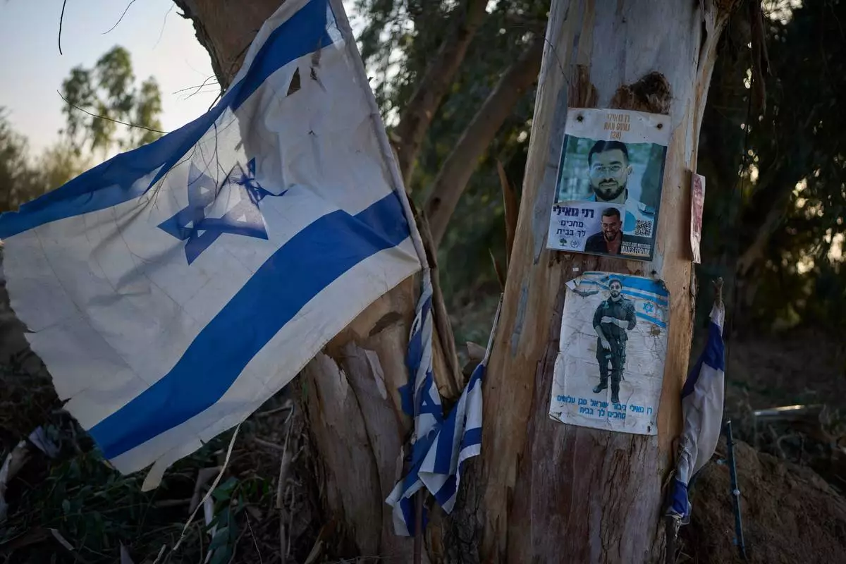 A memorial site at the spot where Ran Gvili, the last hostage in the Gaza Strip, was killed while fighting Hamas militants, stands in Kibbutz Alumim, Israel, Thursday, Dec. 4, 2025. (AP Photo/Ohad Zwigenberg)