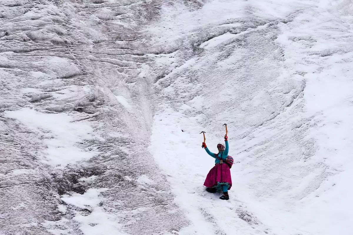 Mountain guide Ana Lia Gonzales climbs the Huayna Potosí glacier near El Alto, Bolivia, Monday, April 14, 2025. (AP Photo/Juan Karita)