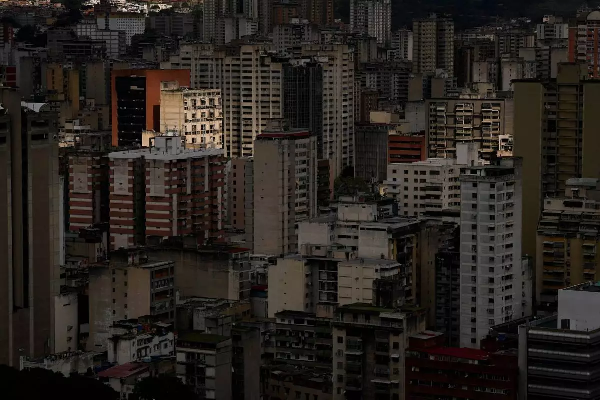Buildings stand in Caracas, Venezuela, Tuesday morning, Dec. 23, 2025. (AP Photo/Matias Delacroix)