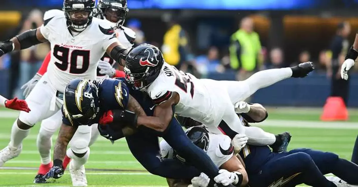 Texans' defense swarms Chargers after offense's fast start in playoff-clinching victory