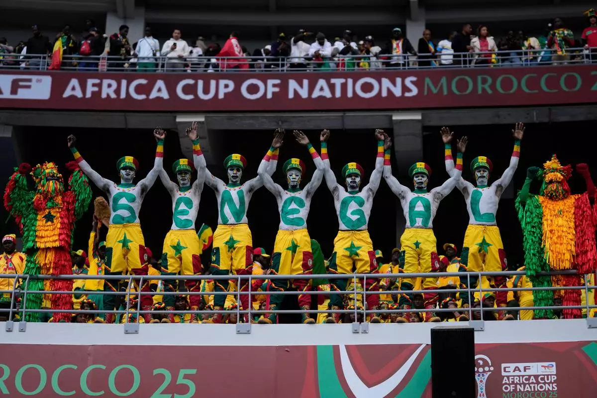 Senegal fans support their national team during the Africa Cup of Nations group D soccer match between Senegal and DR Congo in Tangier, Morocco, Saturday, Dec. 27, 2025. (AP Photo/Themba Hadebe)