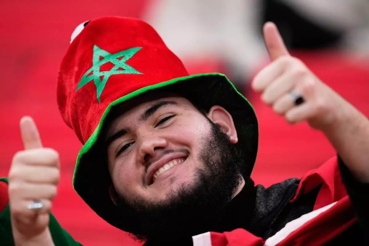 A Moroccan fan waits for the start of the Africa Cup of Nations group A soccer match between Zambia and Morocco in Rabat, Morocco, Monday, Dec. 29, 2025. (AP Photo/Themba Hadebe)
