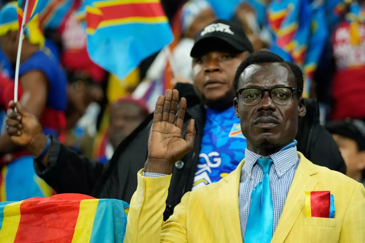 A DR Congo fans cheer prior to the Africa Cup of Nations group D soccer match between Botswana and DR Congo in Rabat, Morocco, Tuesday, Dec. 30, 2025. (AP Photo/Mosa'ab Elshamy)