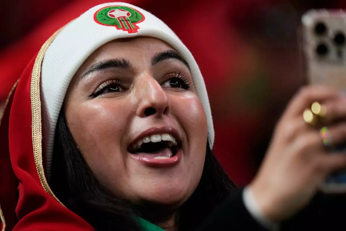 A Moroccan fan waits for the start of the Africa Cup of Nations group A soccer match between Zambia and Morocco in Rabat, Morocco, Monday, Dec. 29, 2025. (AP Photo/Themba Hadebe)