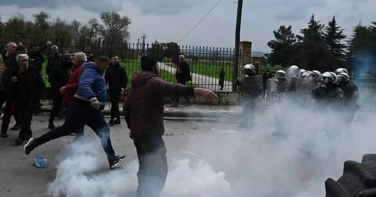 Greek police fire tear gas at protesting farmers threatening to blockade airport